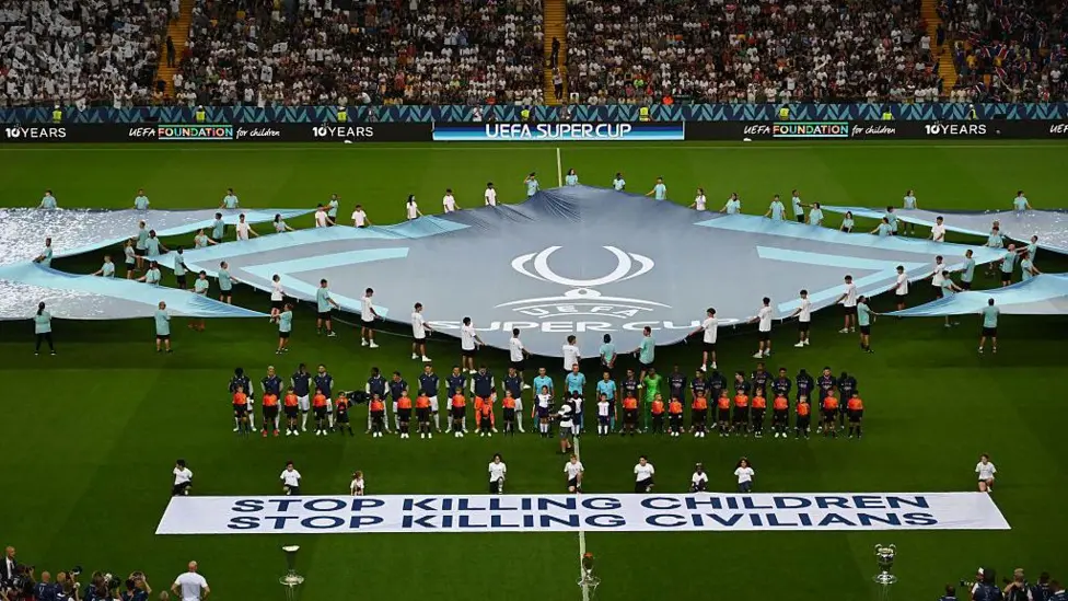Uefa displays 'stop killing children' banner